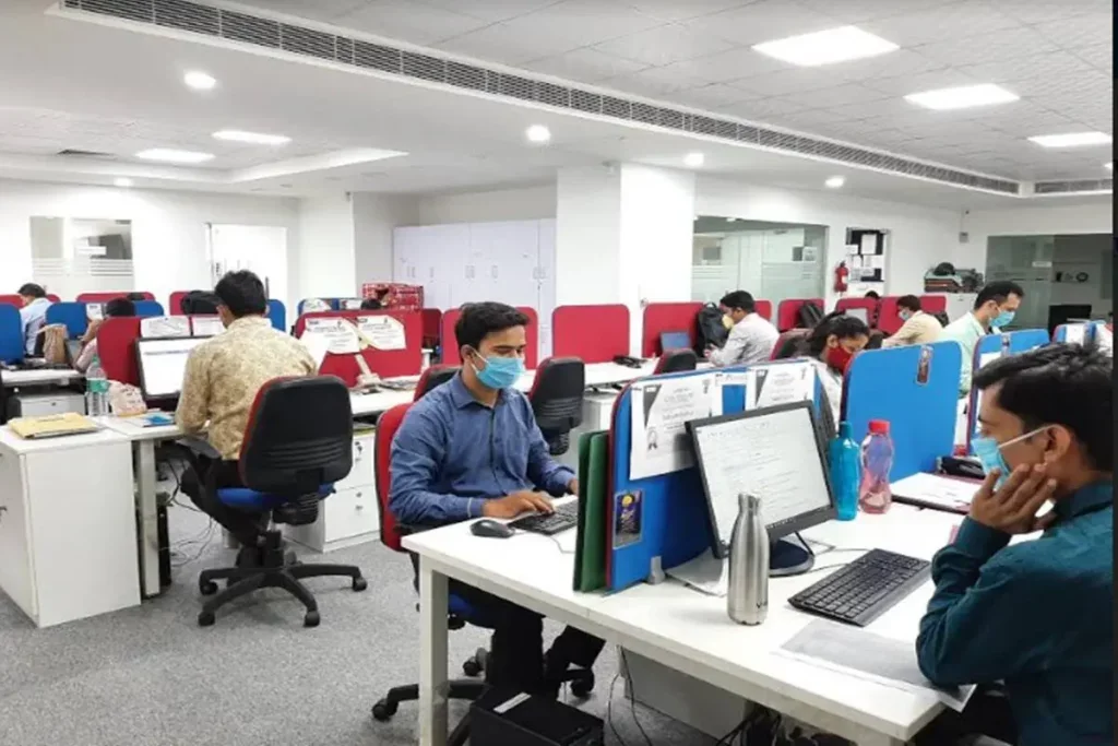 Photos of emplyoees working from office with masks on