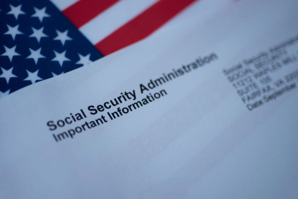 Pittsburgh Resident Sentenced to Two Years’ Probation and a Restitution Amount of $109,413.90 for Conviction of Theft of Government Property Social Security Administration Important Information letter next to flag of USA.