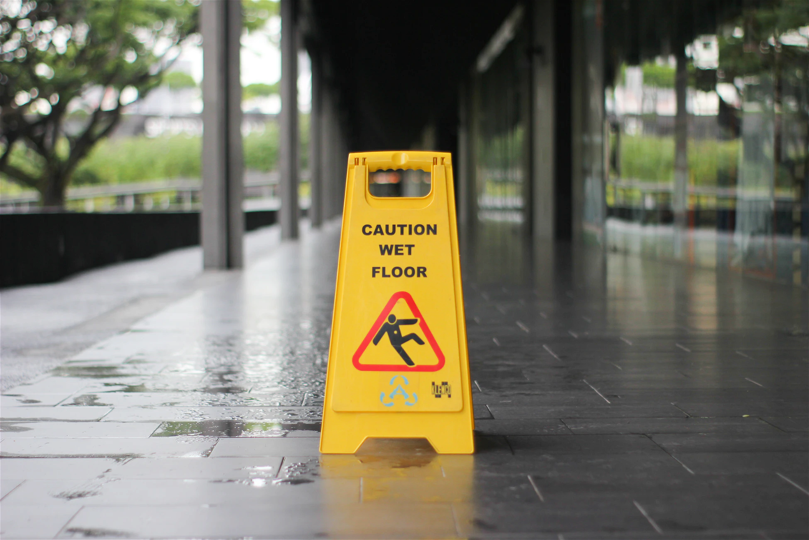 Caution sign sitting on wet floor