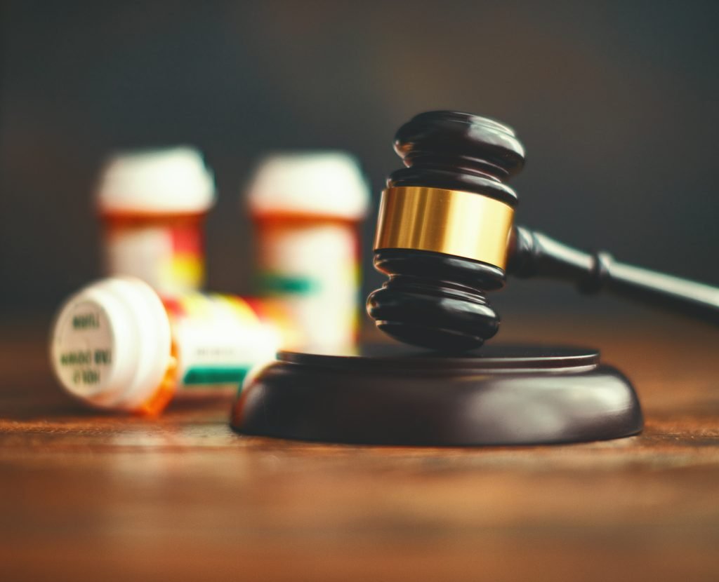 Judge's gavel with medications. Medical malpractice
