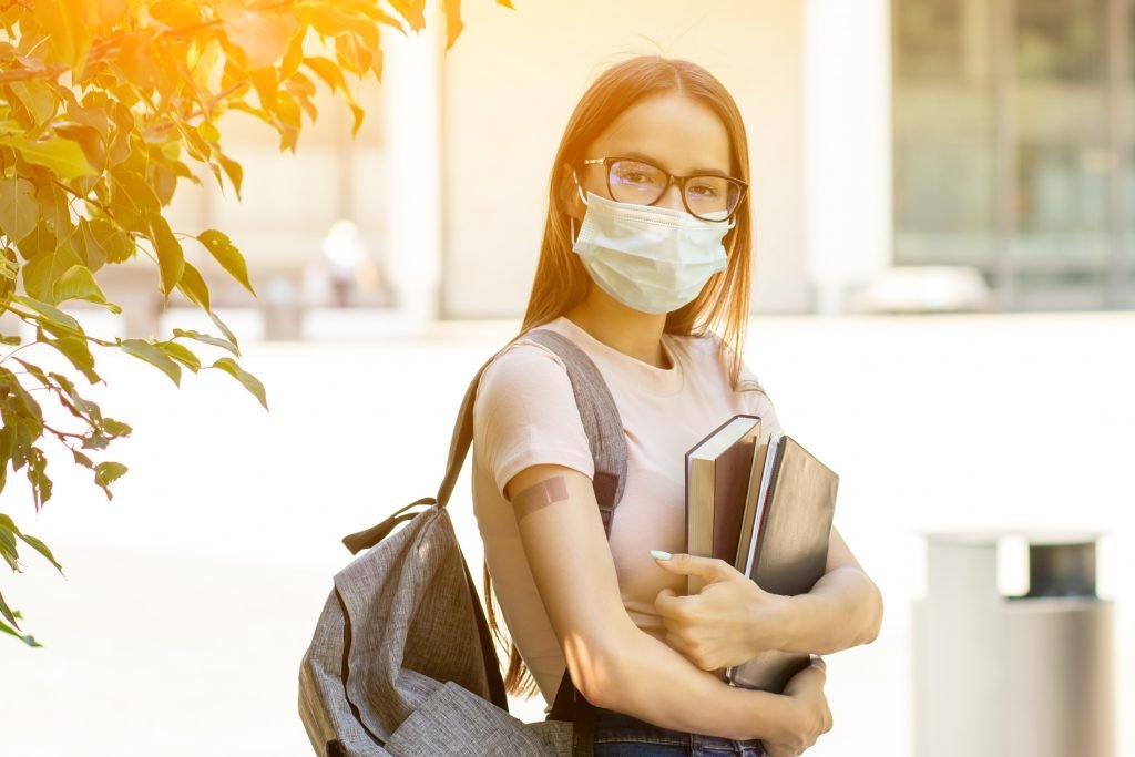 Vaccination covid-19 in schools and colleges, Vaccinated students back to school after coronavirus pandemic over, returning to study after the summer holidays