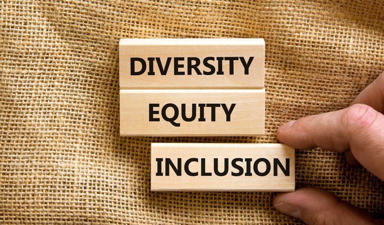 Diversity equity inclusion symbol. Concept words diversity equity inclusion on blocks on beautiful canvas table canvas background. Businessman hand. Business, diversity equity inclusion concept.