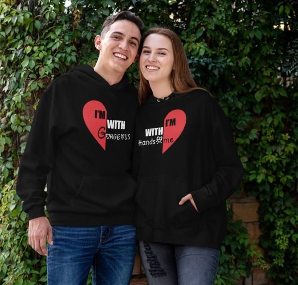 pullover-hoodie-mockup-of-a-smiling-couple-against-a-vertical-garden 1