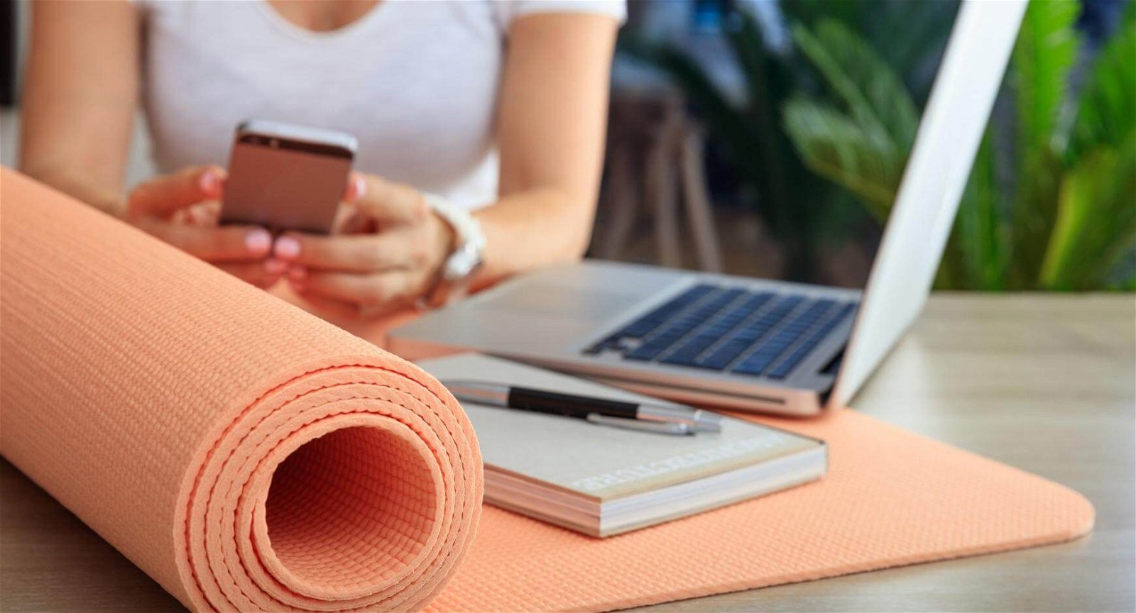 a woman with a yoga mat doing business