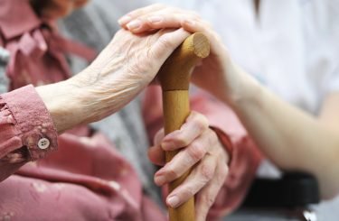 Elderly Woman Hands Cane