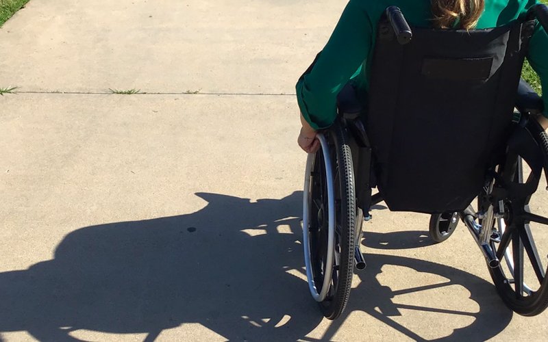 Woman in a wheelchair after amputation