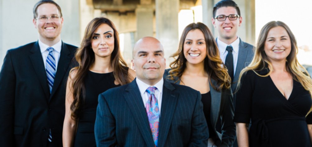 Gastelum Law Team smiling at the camera.