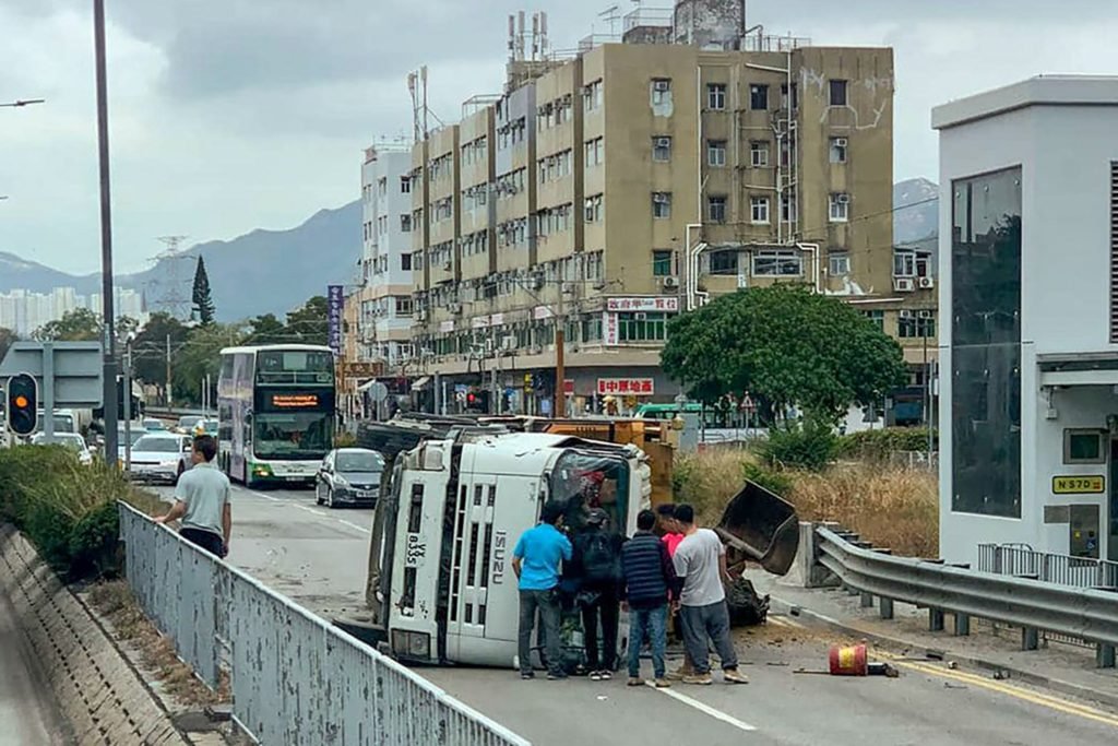 Hong Kong truck driver rescued by passers-by after vehicle overturns - South China Morning Post