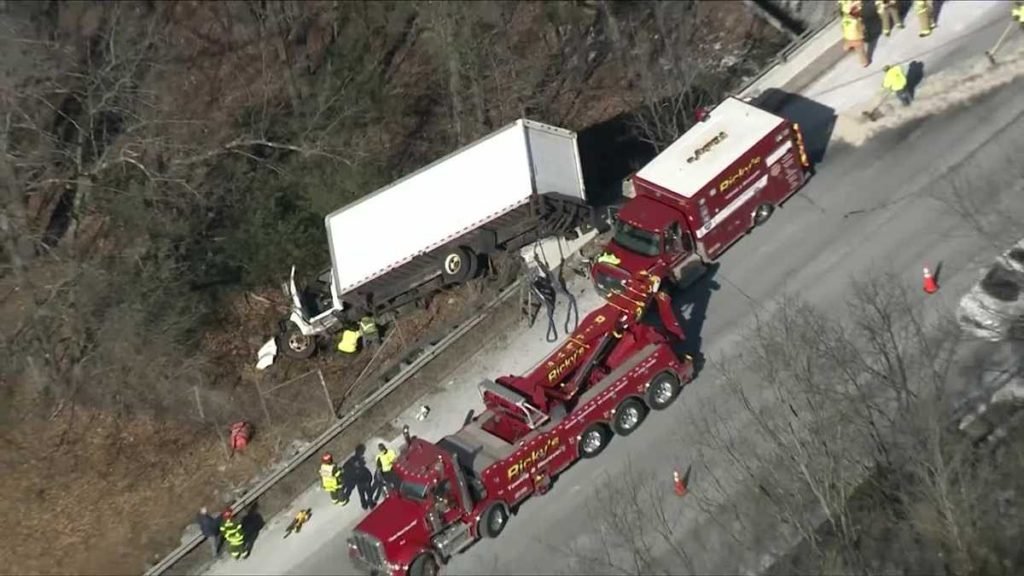 Heavy delays, lanes closed after box truck crashes off side of I-495 - WCVB Boston