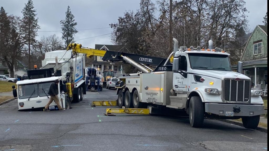 Sinkhole swallows garbage truck in Spokane's Perry District - KREM.com