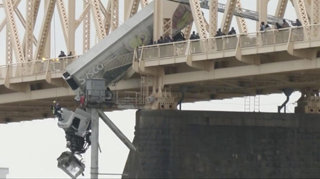 Truck driver pulled to safety after crash leaves vehicle dangling over bridge across Ohio River - Yahoo! Voices