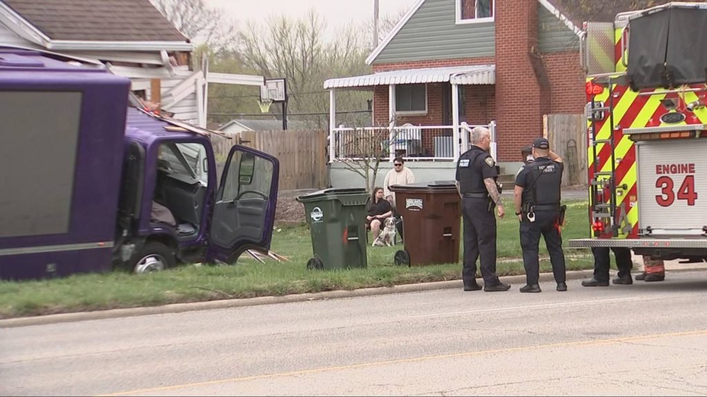 PHOTOS: Advertising truck slams into home in Kettering; driver taken to hospital - WHIO