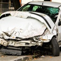 Fatal traffic accident with total damage of white car
