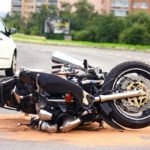 motorcycle tipped sideways after crash